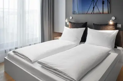 Ein Bett oder Betten in einem Zimmer der Unterkunft AMANO HOME Apartments