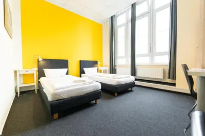 Ein Bett oder Betten in einem Zimmer der Unterkunft Industriepalast Berlin
