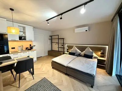 Ein Bett oder Betten in einem Zimmer der Unterkunft Triumph Inn Pension