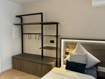 Ein Bett oder Betten in einem Zimmer der Unterkunft Triumph Inn Pension