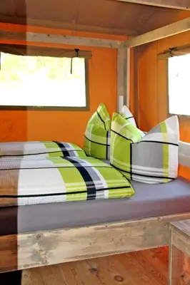 Ein Bett oder Betten in einem Zimmer der Unterkunft Safarizelte