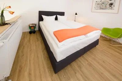 Ein Bett oder Betten in einem Zimmer der Unterkunft Country Inn Suitenhotel