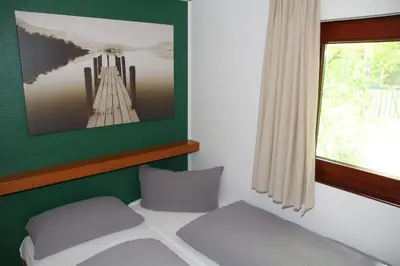 Ein Bett oder Betten in einem Zimmer der Unterkunft Waldkiez Tiefensee