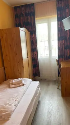 Ein Bett oder Betten in einem Zimmer der Unterkunft Hotel Spreewitz am Kurfürstendamm