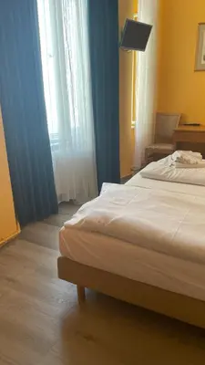 Ein Bett oder Betten in einem Zimmer der Unterkunft Hotel Spreewitz am Kurfürstendamm