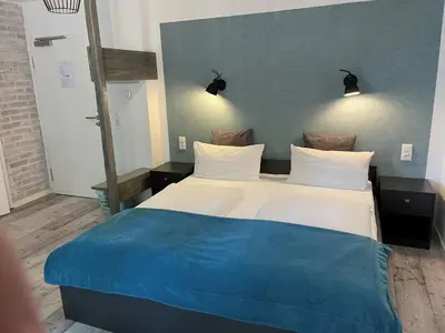 Ein Bett oder Betten in einem Zimmer der Unterkunft Aparthotel Walhalla Potsdam