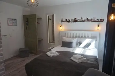 Ein Bett oder Betten in einem Zimmer der Unterkunft Aparthotel Walhalla Potsdam
