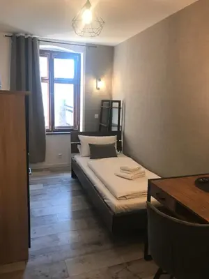 Ein Bett oder Betten in einem Zimmer der Unterkunft Aparthotel Walhalla Potsdam