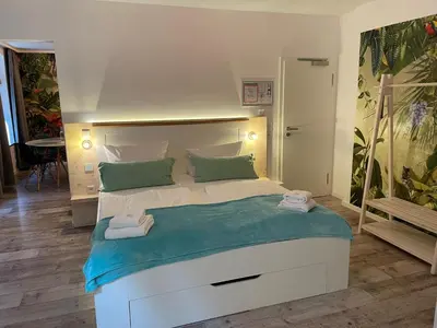 Ein Bett oder Betten in einem Zimmer der Unterkunft Aparthotel Walhalla Potsdam