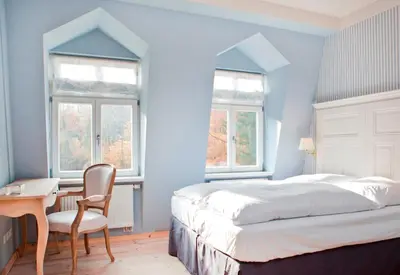 Ein Bett oder Betten in einem Zimmer der Unterkunft Gut Sarnow - Hotel und Restaurant