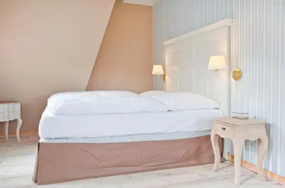Ein Bett oder Betten in einem Zimmer der Unterkunft Gut Sarnow - Hotel und Restaurant