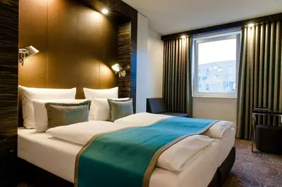 Ein Bett oder Betten in einem Zimmer der Unterkunft Motel One Berlin-Bellevue