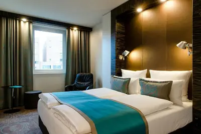Ein Bett oder Betten in einem Zimmer der Unterkunft Motel One Berlin-Bellevue