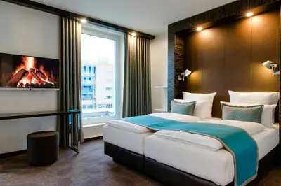 Ein Bett oder Betten in einem Zimmer der Unterkunft Motel One Berlin-Bellevue
