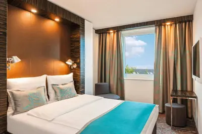 Ein Bett oder Betten in einem Zimmer der Unterkunft Motel One Berlin-Tiergarten