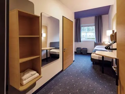 Ein Bett oder Betten in einem Zimmer der Unterkunft B&B HOTEL Berlin-Potsdamer Platz