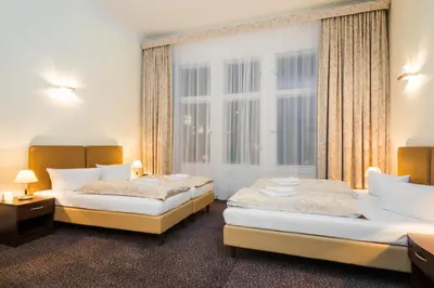Ein Bett oder Betten in einem Zimmer der Unterkunft Upper Room Hotel Kurfürstendamm