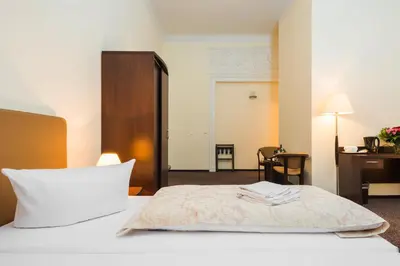 Ein Bett oder Betten in einem Zimmer der Unterkunft Upper Room Hotel Kurfürstendamm