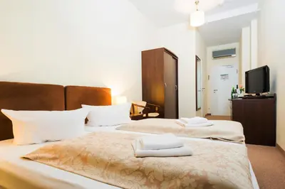 Ein Bett oder Betten in einem Zimmer der Unterkunft Upper Room Hotel Kurfürstendamm