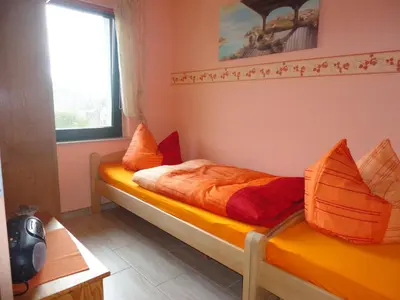 Ein Bett oder Betten in einem Zimmer der Unterkunft Ferienhaus Krüger