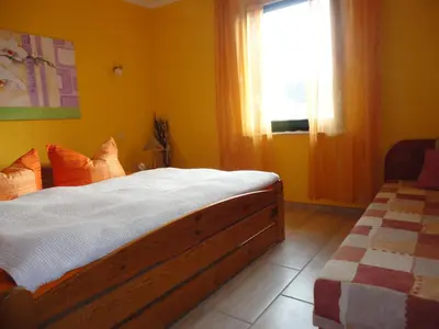 Ein Bett oder Betten in einem Zimmer der Unterkunft Ferienhaus Krüger