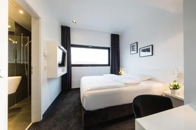 Ein Bett oder Betten in einem Zimmer der Unterkunft LINDEMANN'S