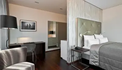 Ein Bett oder Betten in einem Zimmer der Unterkunft COSMO Hotel Berlin Mitte