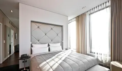 Ein Bett oder Betten in einem Zimmer der Unterkunft COSMO Hotel Berlin Mitte