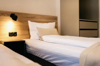 Ein Bett oder Betten in einem Zimmer der Unterkunft 120qm MyGold Apartment 2 Bathrooms Balcony Up to 9 Guests