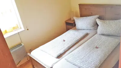 Ein Bett oder Betten in einem Zimmer der Unterkunft Ferienwohnungen Margaretenhof am Plauer See