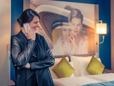 Ein Bett oder Betten in einem Zimmer der Unterkunft MERCURE Hotel Berlin Wittenbergplatz