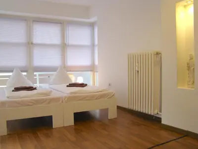 Ein Bett oder Betten in einem Zimmer der Unterkunft Rooms & Apartments near Zoologischer Garten