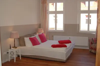 Ein Bett oder Betten in einem Zimmer der Unterkunft Schloss-und Seeblick Apartment