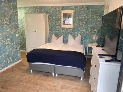 Ein Bett oder Betten in einem Zimmer der Unterkunft Guest House Altes Forstamt
