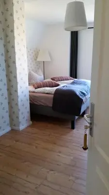 Ein Bett oder Betten in einem Zimmer der Unterkunft Guest House Altes Forstamt