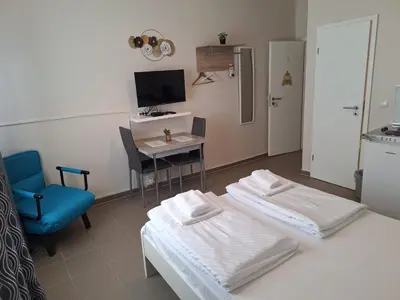 Ein Bett oder Betten in einem Zimmer der Unterkunft Elifim