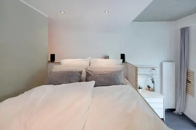 Ein Bett oder Betten in einem Zimmer der Unterkunft Modern Design Apartment
