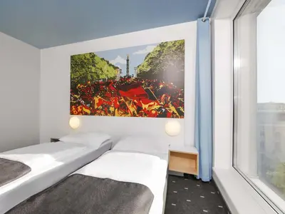 Ein Bett oder Betten in einem Zimmer der Unterkunft B&B Hotel Berlin-Tiergarten
