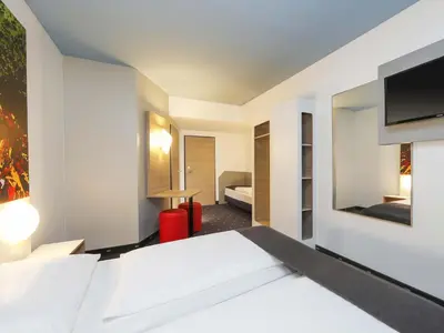 Ein Bett oder Betten in einem Zimmer der Unterkunft B&B Hotel Berlin-Tiergarten