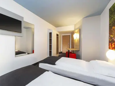 Ein Bett oder Betten in einem Zimmer der Unterkunft B&B Hotel Berlin-Tiergarten