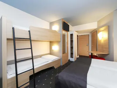 Ein Bett oder Betten in einem Zimmer der Unterkunft B&B Hotel Berlin-Tiergarten