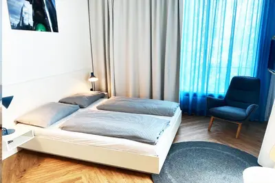 Ein Bett oder Betten in einem Zimmer der Unterkunft smartments Berlin City West