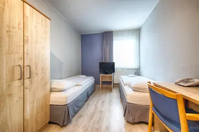 Ein Bett oder Betten in einem Zimmer der Unterkunft enjoy hostel Berlin City West