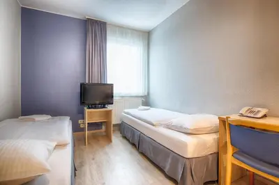 Ein Bett oder Betten in einem Zimmer der Unterkunft enjoy hostel Berlin City West