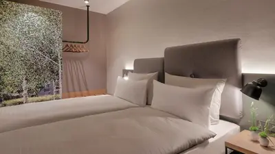 Ein Bett oder Betten in einem Zimmer der Unterkunft Hotel the YARD Berlin