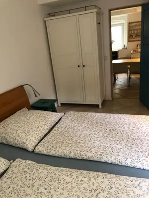 Ein Bett oder Betten in einem Zimmer der Unterkunft Lilienthalschlösschen