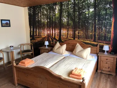 Ein Bett oder Betten in einem Zimmer der Unterkunft Hotel Schützenhaus