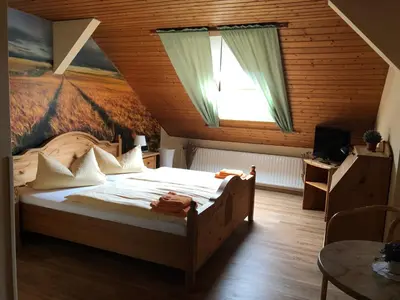Ein Bett oder Betten in einem Zimmer der Unterkunft Hotel Schützenhaus