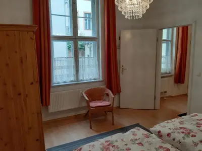 Ein Bett oder Betten in einem Zimmer der Unterkunft Ferienwohnung Am Nauener Tor