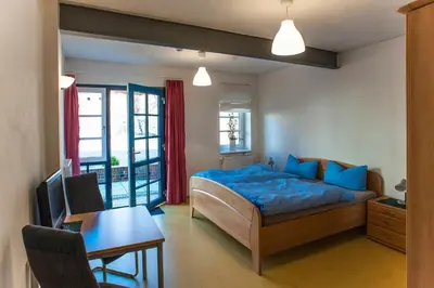 Ein Bett oder Betten in einem Zimmer der Unterkunft Hof Märkische Heide